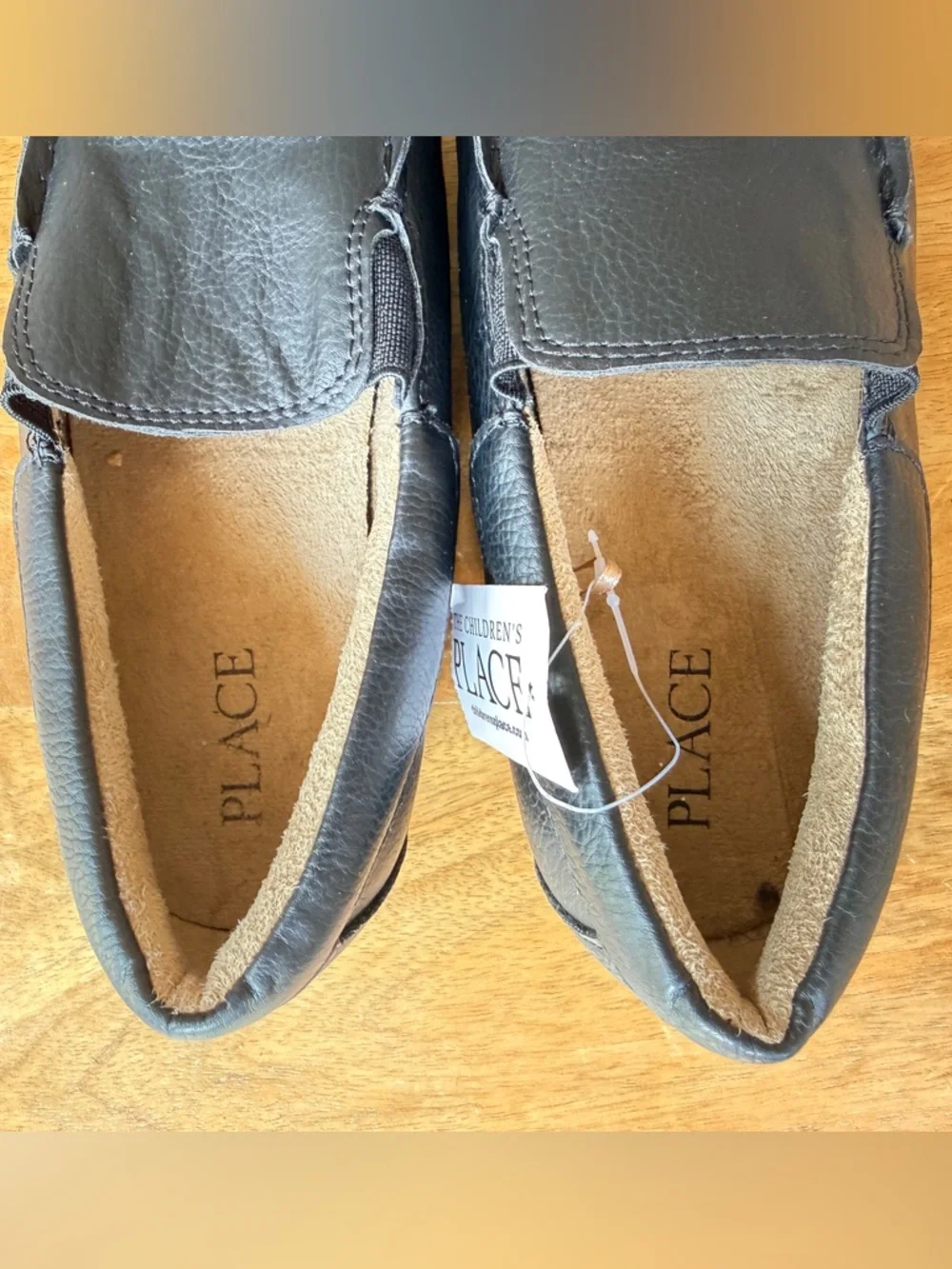 The Children's Place Black Slip-On moccasins.
